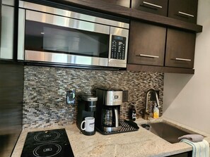 Fridge, microwave, stovetop, coffee/tea maker