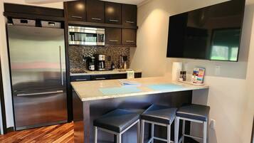 Fridge, microwave, stovetop, coffee/tea maker