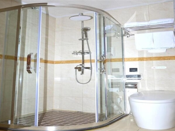 A glass-enclosed shower stall with a handheld showerhead, a toilet, and a towel rack. - Greentree Inn Chizhou Dongzhi County Lishan Xiushui Express Hotel (Chizhou)