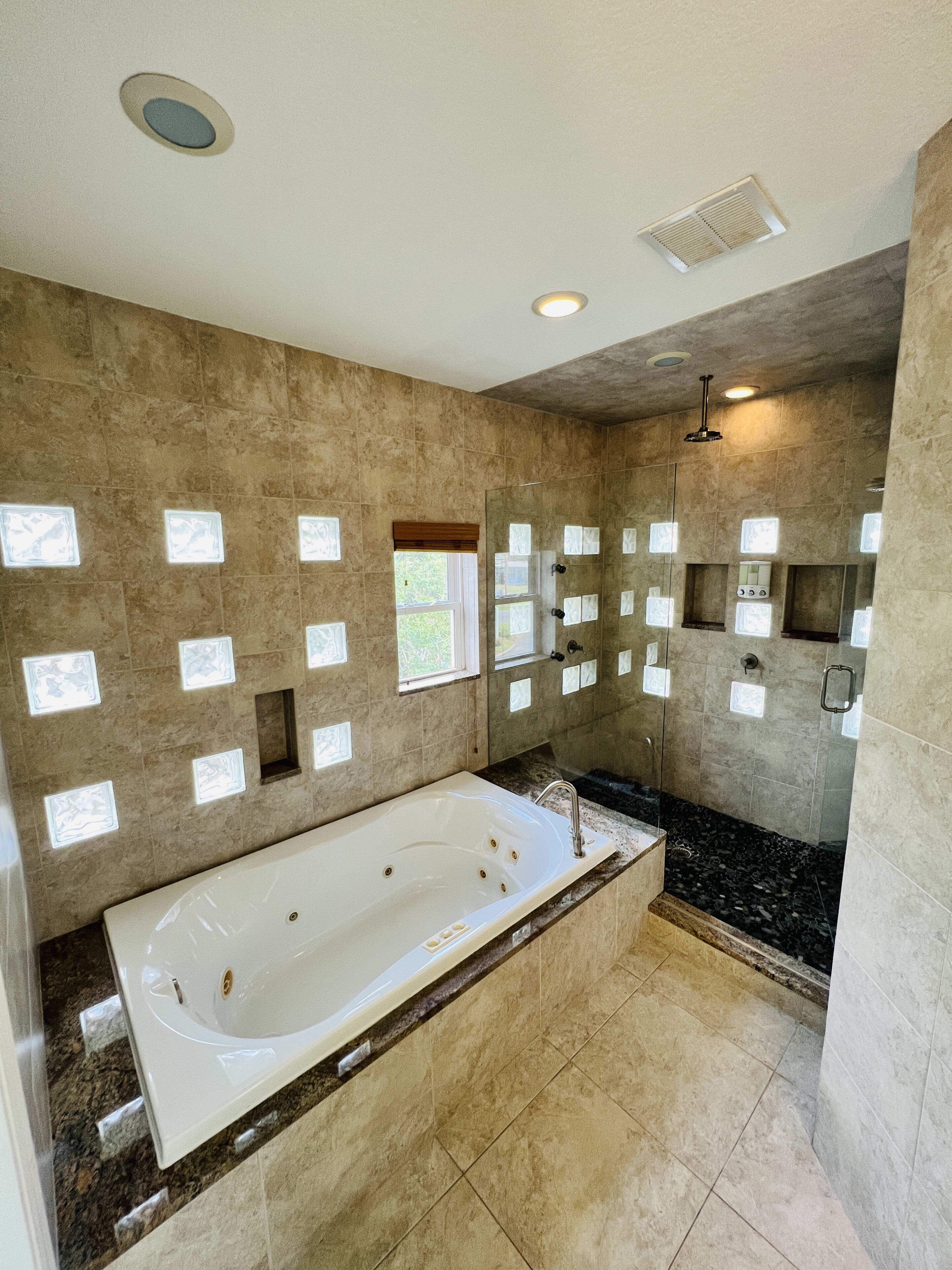 Bathtub, hair dryer, towels, soap