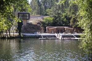 Enjoy serene lakeside views from this modern lakeside retreat, featuring a dock and tranquil surroundings.