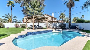 A backyard with a swimming pool, a covered patio, and a house. - Nintendo Super Mario Bros Castle in Scottsdale  (Scottsdale)