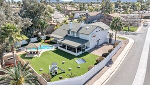 A residential property with a large house, a swimming pool, and a well-maintained lawn. - Nintendo Super Mario Bros Castle in Scottsdale  (Scottsdale)