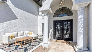 A white building with a black door, a white column, and a beige floor. - Nintendo Super Mario Bros Castle in Scottsdale  (Scottsdale)