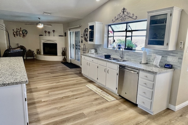 Beautiful kitchen area all new flooring and everything you see fully stocked