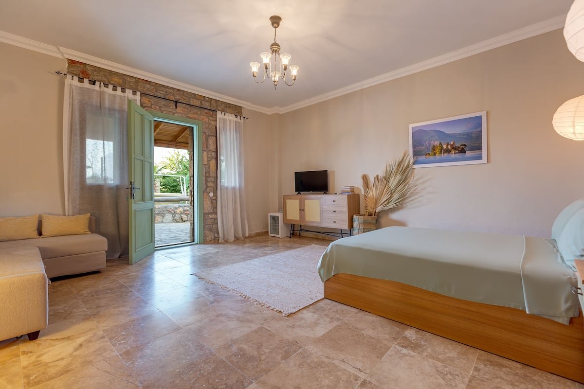 Deluxe Room, Patio, Pool View | 1 bedroom, minibar, in-room safe, individually decorated