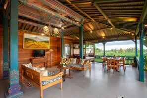 Three bedroom private pool villa | Living area | 50-inch flat-screen TV with satellite channels, TV, fireplace - Arya Arkananta Resort & Spa (Ubud)