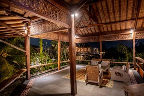 Family Three Bedroom Private Pool Villa | Living area | 50-inch flat-screen TV with satellite channels, TV, fireplace - Arya Arkananta Resort & Spa (Ubud)