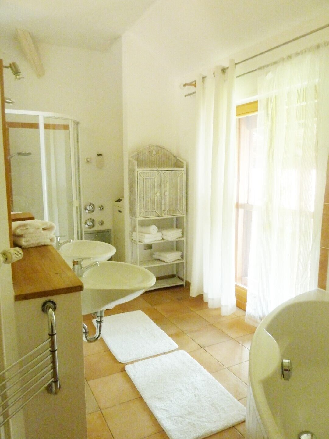 Bathtub, hair dryer, towels, soap