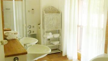 Bathtub, hair dryer, towels, soap