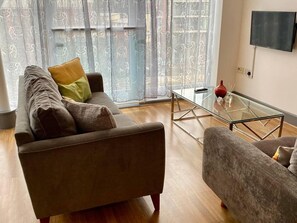 Apartment | Living room | 30-inch TV with digital channels