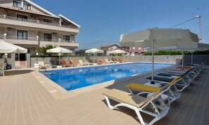 Outdoor pool, pool umbrellas, pool loungers