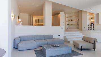 Suíte luxo | Área de estar | TV de tela plana