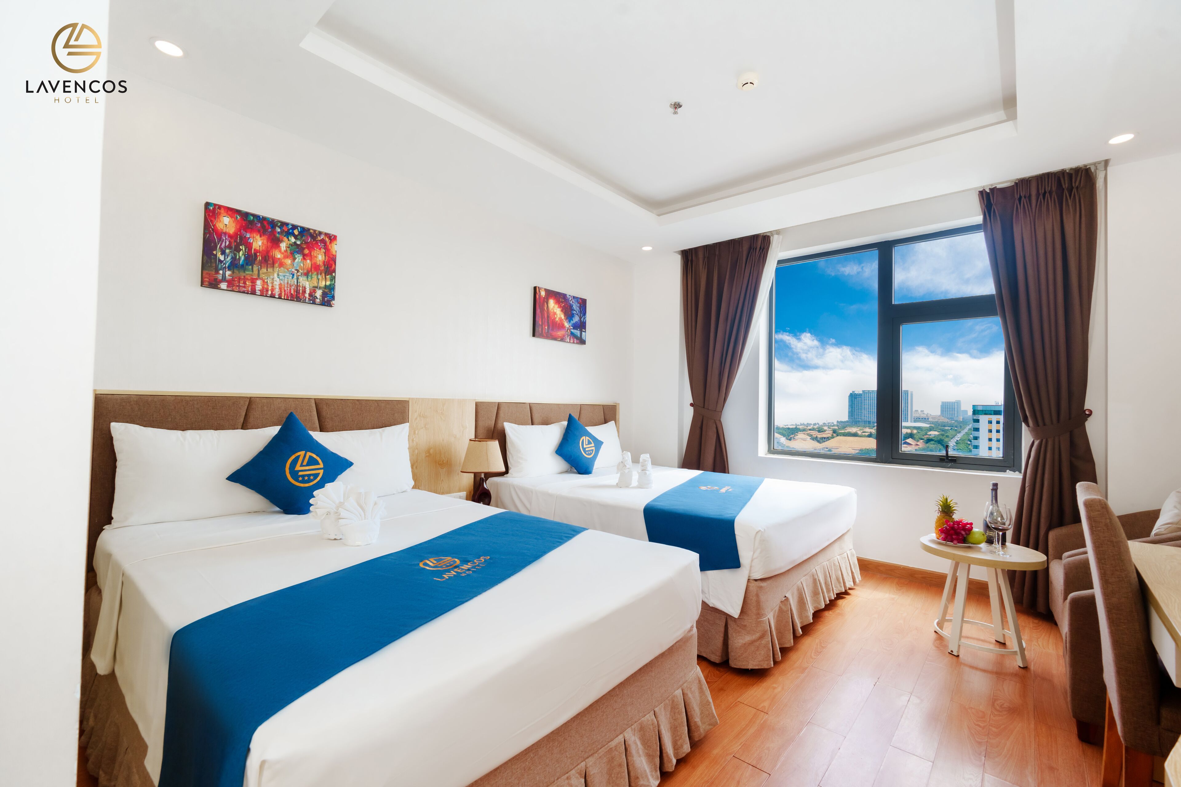 Deluxe Twin Room, City View | Minibar, in-room safe, desk, laptop workspace