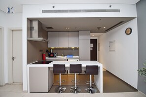 Apartment | Private kitchen | Full-size fridge, microwave, oven, stovetop
