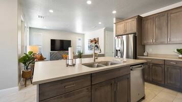 Townhome, 5 Bedrooms | Private kitchen | Fridge, oven, coffee/tea maker, highchair