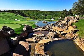 Play amidst lush greenery and natural features on this well-maintained golf course.