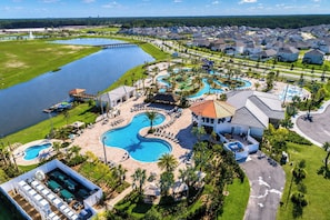 A resort with a large swimming pool, a water park, and a golf course.