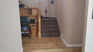 A home office with a desk, computer, and chair, a staircase, and a small window. - #2 - Beautiful room with a view with a King bed (St. George)