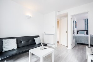 Apartment | Living room | 30-inch TV with digital channels