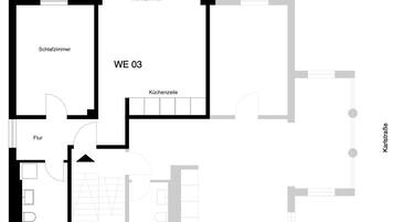 A floor plan of a hotel with labeled rooms including a living room, bedroom, and kitchen area.