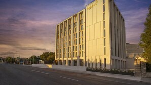 A modern hotel building with a clean, rectangular design and a prominent sign. - Maldron Hotel Merrion Road (Dublin)