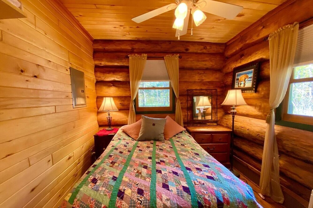Beautiful log cabin on a private wooded lot