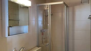 Shower, towels, soap, toilet paper