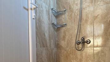 Shower, hair dryer, towels, toilet paper