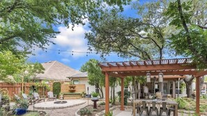A patio with a pergola, outdoor seating, and a fire pit. - 5BR/CedarPark/Soothing Sauna/HotTub/Peloton (Cedar Park)