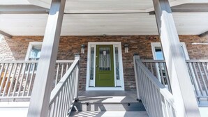 A building entrance with a sign reading '28 Weaver Avenue.'