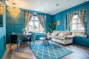 The Investment Lounge | Living area | 40-inch Smart TV with satellite channels, TV, iPad