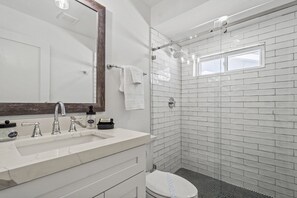 Shower, hair dryer, towels, soap