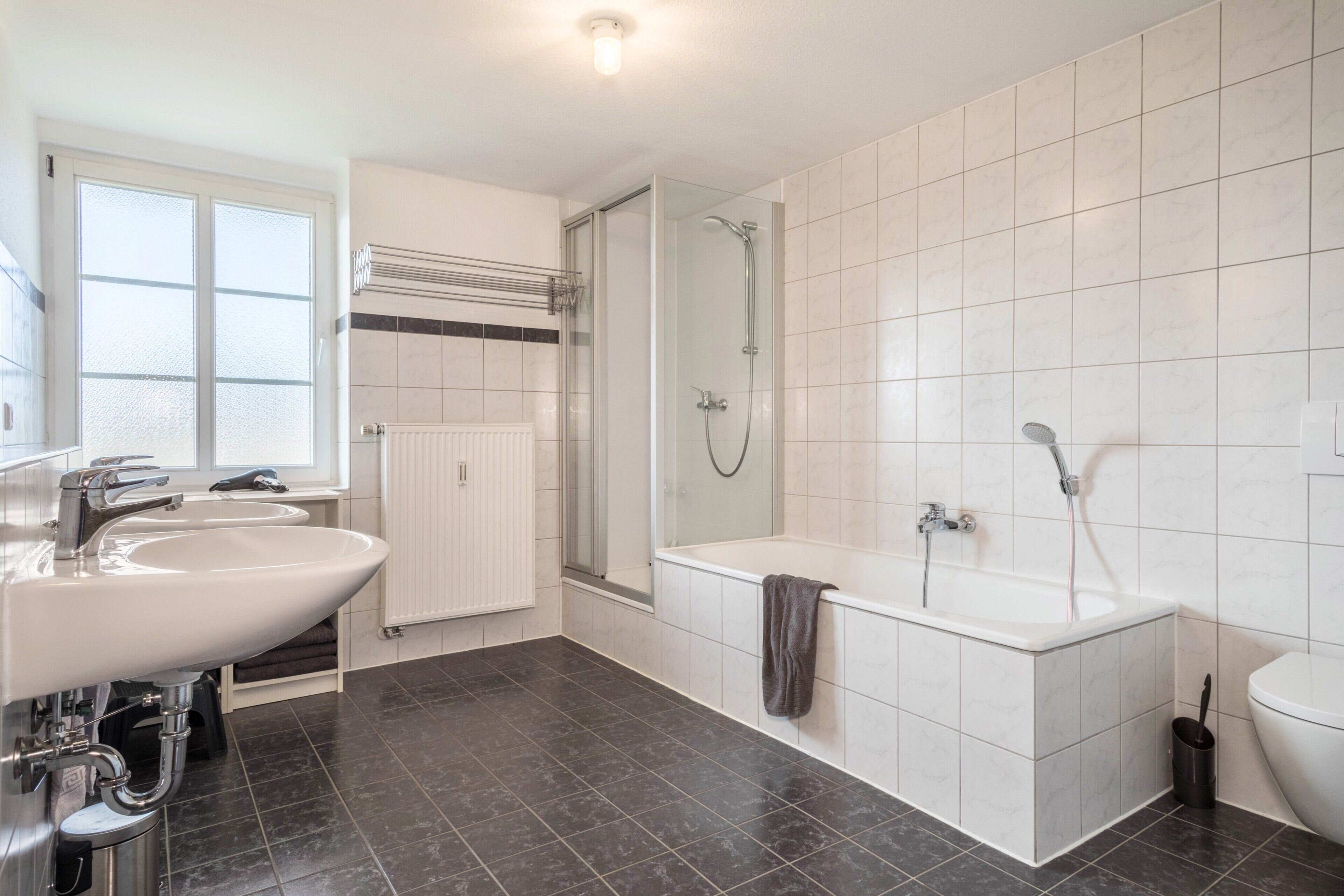 Bathtub, hair dryer, towels