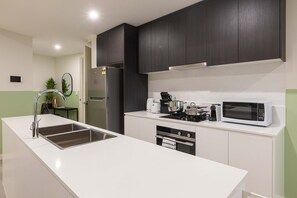 Superior Apartment, 3 Bedrooms | Private kitchen | Full-size fridge, microwave, oven, stovetop