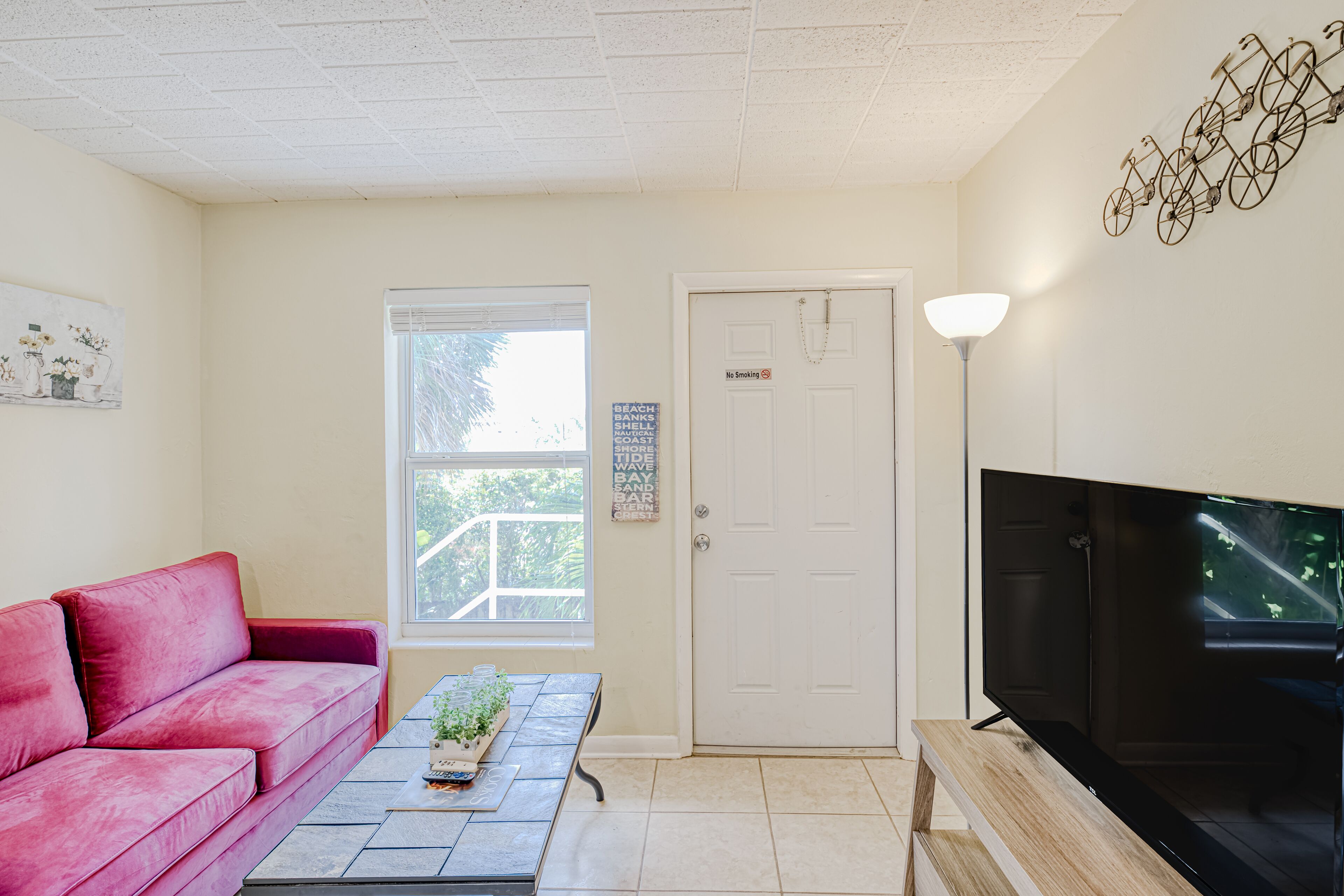 Adorable second-floor home with WiFi, shady patios, shared W/D, & kitchenette