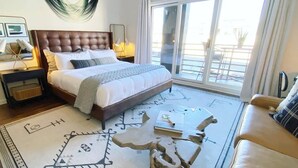 A bedroom with a large bed, a nightstand, a bedside table, a sofa, and a view of the outside. - Labor Day Sale - Limited Time Offer, Save up to 30% (Park City)