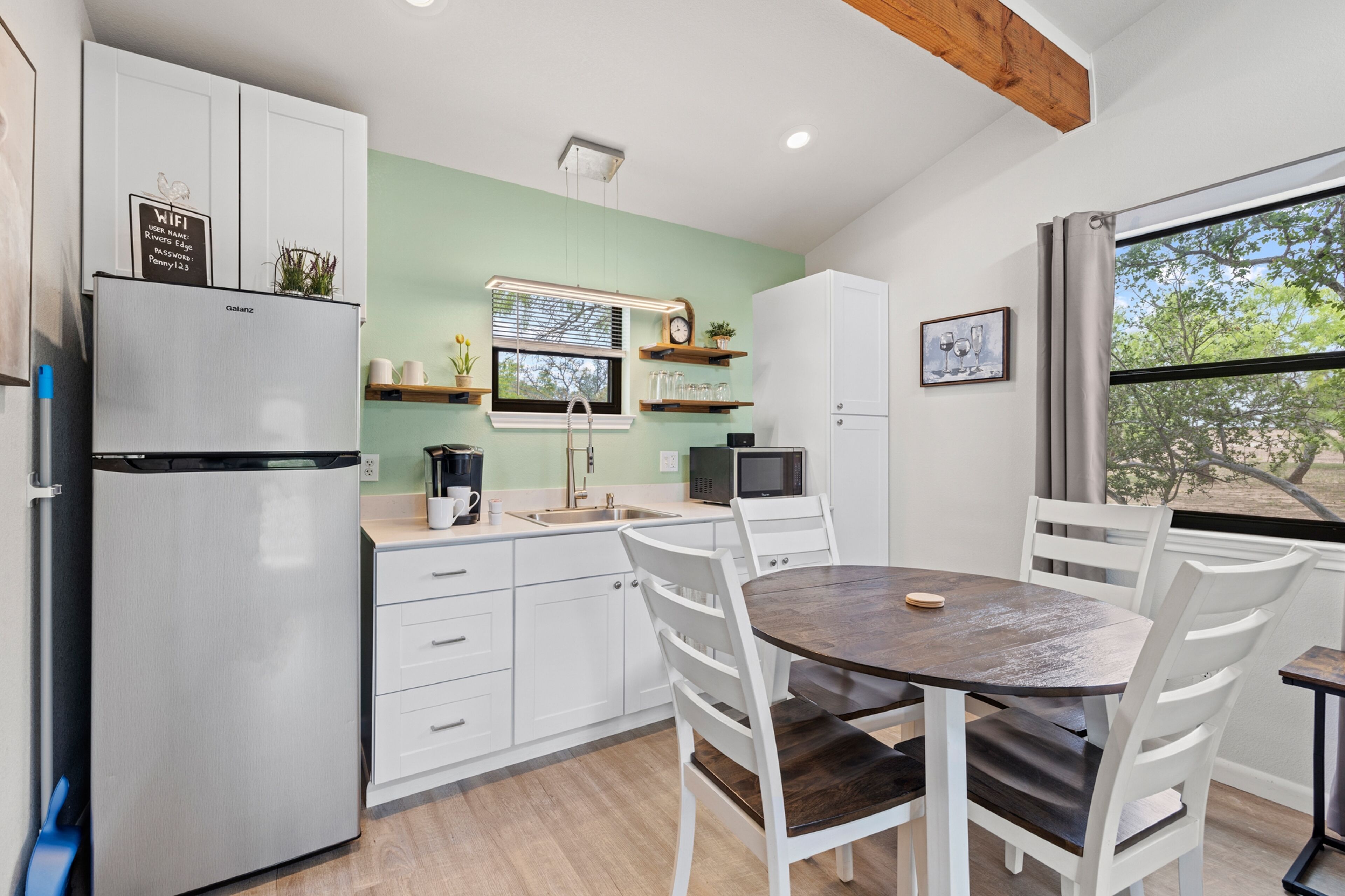 River's Edge Cottage with private hot tub, waterfront locale & river views