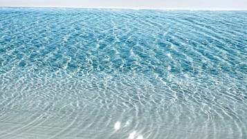 On the beach, sun-loungers
