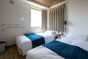 Standard Twin Room | Blackout drapes, iron/ironing board, free WiFi, bed sheets