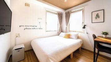 Blackout curtains, iron/ironing board, free WiFi, bed sheets