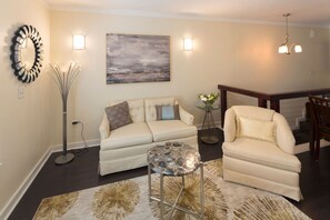 Condo, 1 Queen Bed | Living room | 36-inch TV with satellite channels - Villa on Broughton Carriage by Lucky Savannah (Savannah)