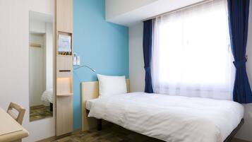 Down duvets, desk, laptop workspace, blackout curtains