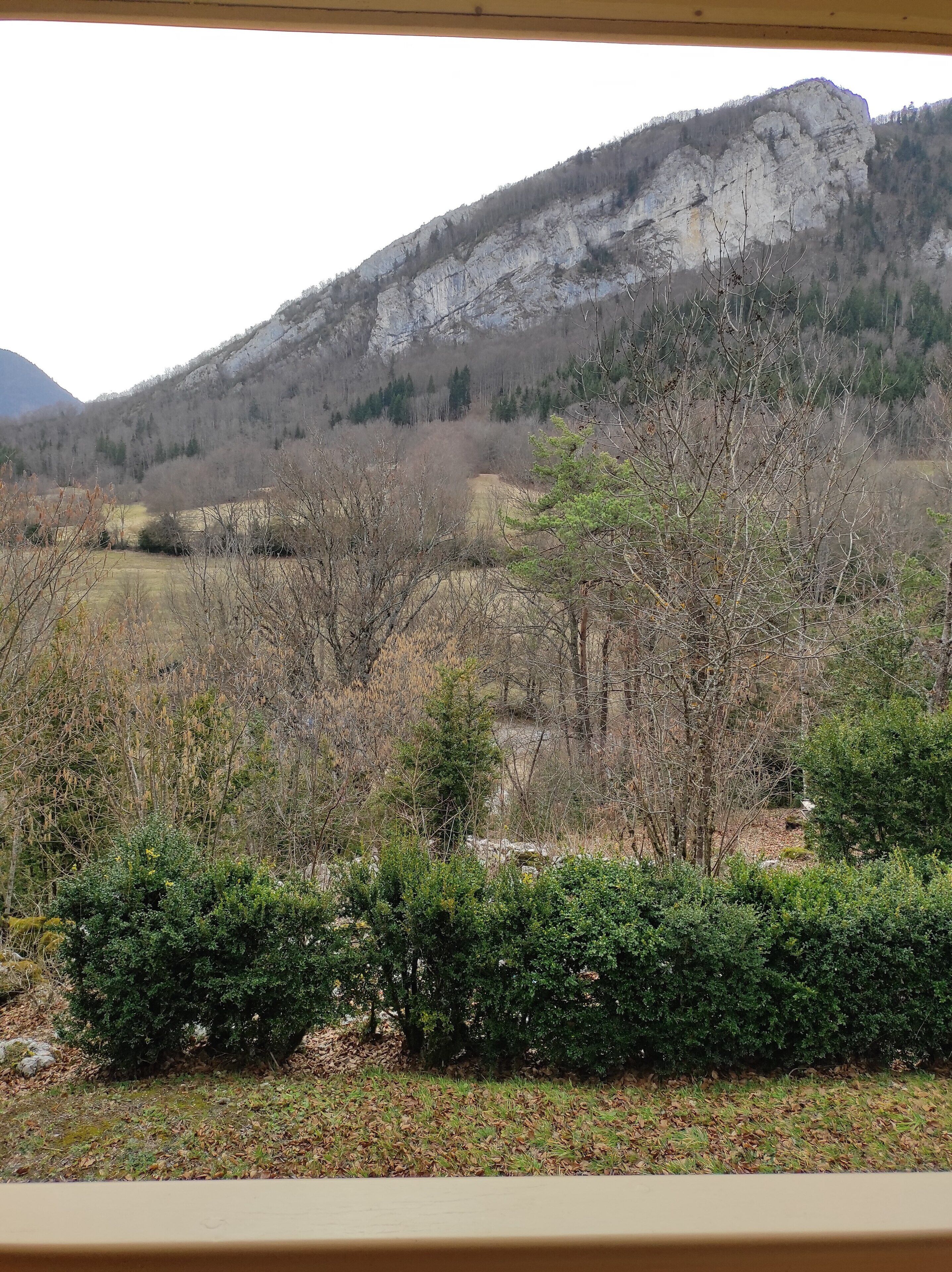 A view of a mountainous landscape with a clear sky.