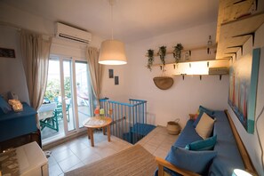 Toetasjesleilighet | Oppholdsområde | Flatskjerm-TV og peis