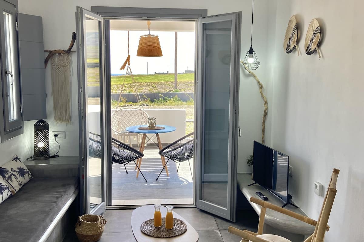 luxury suite, sea view | living area | 32-inch smart tv with satellite channels, tv