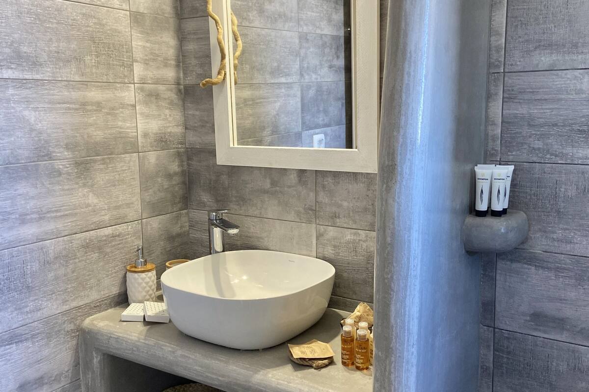 luxury suite, sea view | bathroom | hydromassage showerhead, designer toiletries, hair dryer, dressing gowns