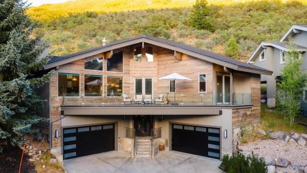 A modern two-story house with a large balcony, a garage, and a swimming pool. - Nansen Villa (Park City)