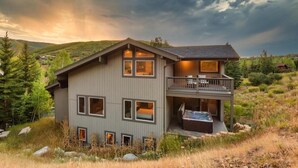 A modern two-story house with a balcony and a hot tub. - Nansen Villa (Park City)