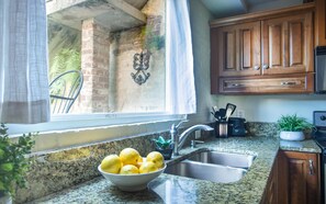 Condo, 1 Bedroom | Private kitchen - Garden Oasis by Lucky Savannah (Savannah)